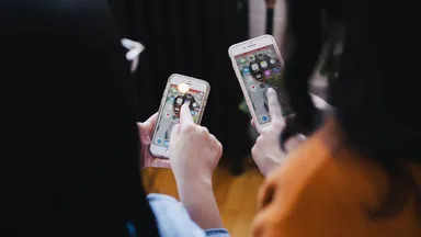 two women on their smartphone
